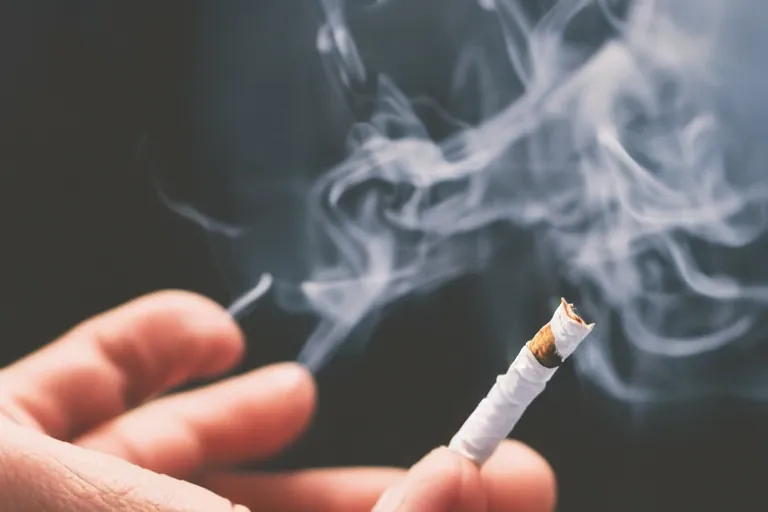 Image similar to Close-up of thin soft hand holding cigarette with smoke, hyper realistic, high details, photo, super resolution