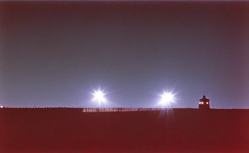 Image similar to lighthouse that shines with a red beam, field, night, unsettling, photo 1998