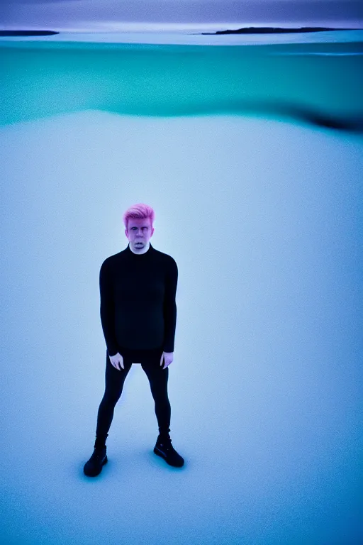 Image similar to high quality pastel coloured film wide angle selfie photograph of a plain looking male with cyber enhancement standing in an icelandic black rock environment. sarcastic expression. three point light. photographic. art directed. pastel colours. volumetric light. stark. waves glitch. 8 k. filmic.