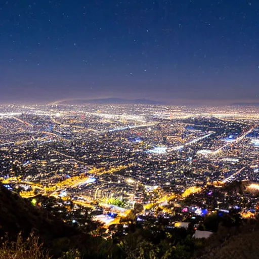 Prompt: a view of los angeles from the hollywood sign at night