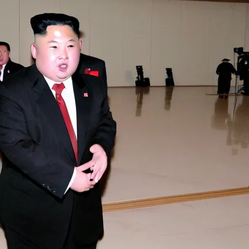 Prompt: paparazzi photo of Kim Jong-un with a microphone in his left hand rapping alone in a empty theater, wide angle, uhd, 8k, award winning