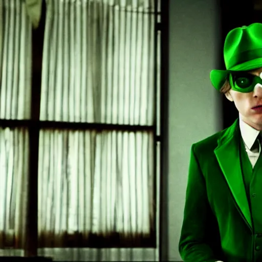 Prompt: film still of Paul Dano as Riddler in a green suit and tie and green fedora in a dark room in The Batman, 4k, dark lighting!!!!, film noir, grainy, dark tone