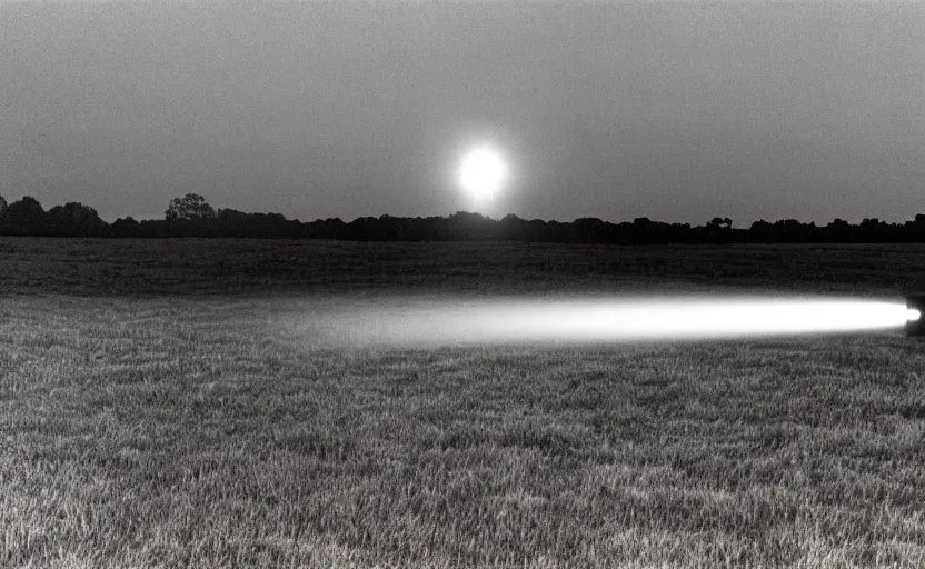 Image similar to red beam of light from lighthouse rotating over the field, night, unsettling, fire on the horizon, photo 1998