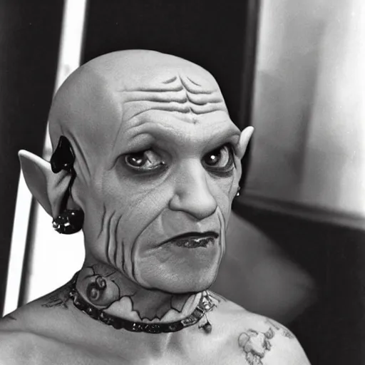 Prompt: ferengi from star trek with tons of ear piercings and tattoos