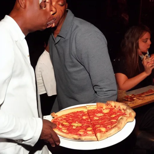 Image similar to dave chapelle biting into a slice of pizza at on stage at a comedy club