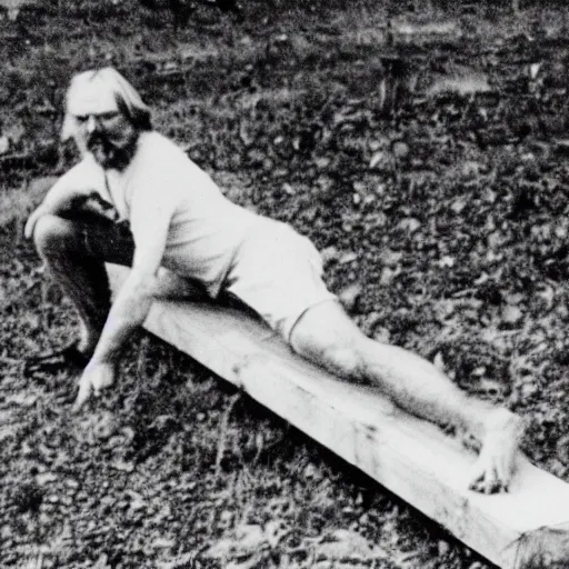 Image similar to robert wyatt gnawing on a long plank of wood, black and white photograph