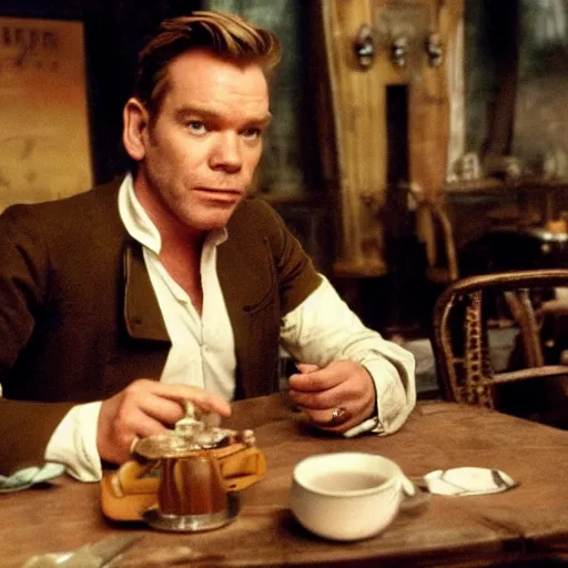 Image similar to ewan mcgregor is sitting at table in a cafe at paris in early 2 0 th century. next to him is a brown cat licking milk from little saucer, atmospheric feeling, warm colours, brown colours, yellow colours, epic scene, cinematic, very detailed