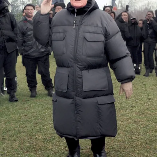 Image similar to john paul ii posing in a black puffed nuptse, black cargo pants and high black boots, press paparazzi photograph