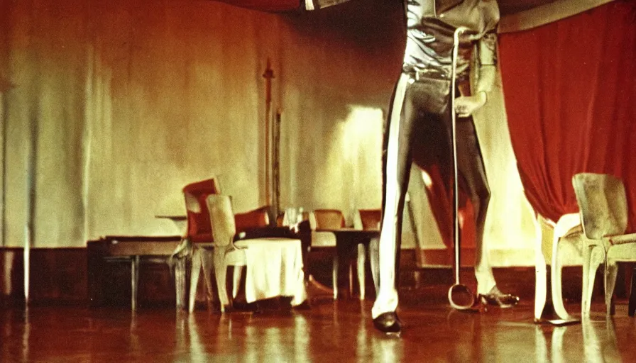 Image similar to 70s movie still of a man with elongated head in a soviet ballroom, eastmancolor, heavy grain, high quality, higly detailed, liminal space