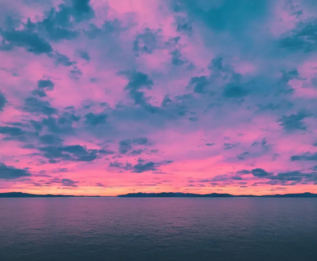 Image similar to majestic landscape, beautiful environment, pink sky, sunset, calm, serene