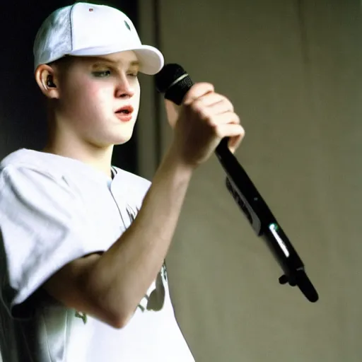 Image similar to 19-year-old white boy wearing backwards baseball cap, baggy jeans, rapping into microphone, nü metal concert, rap metal, alternative metal, 1999 photograph