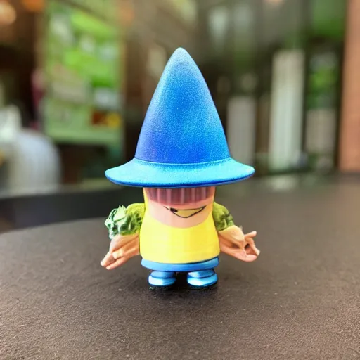 Prompt: a wizard with a blue hat vinyl figure