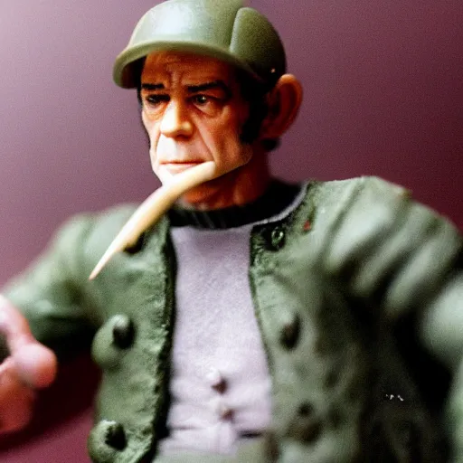 Image similar to Photo of a Gilles Deleuze action figure in its box