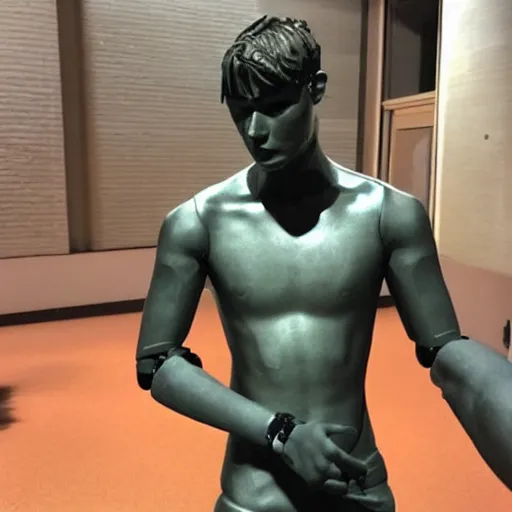 Image similar to “a realistic detailed photo of a guy who is an attractive humanoid who is half robot and half humanoid, who is a male android, American freestyle and folkstyle wrestler Daton Fix, shiny skin, posing like a statue, blank stare, at college, on display”