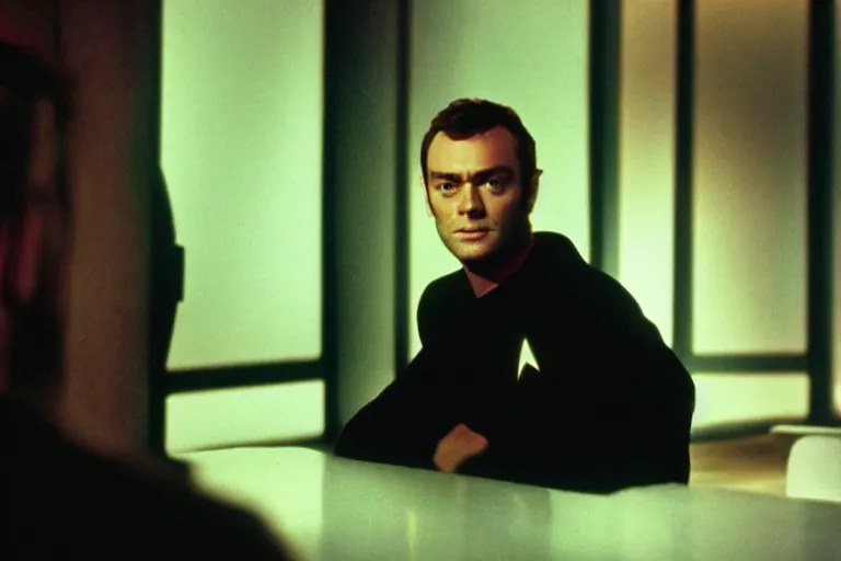 Image similar to A film still of Jude Law in a Star Trek: The Next Generation, sitting in Ten Forward, dramatic lighting