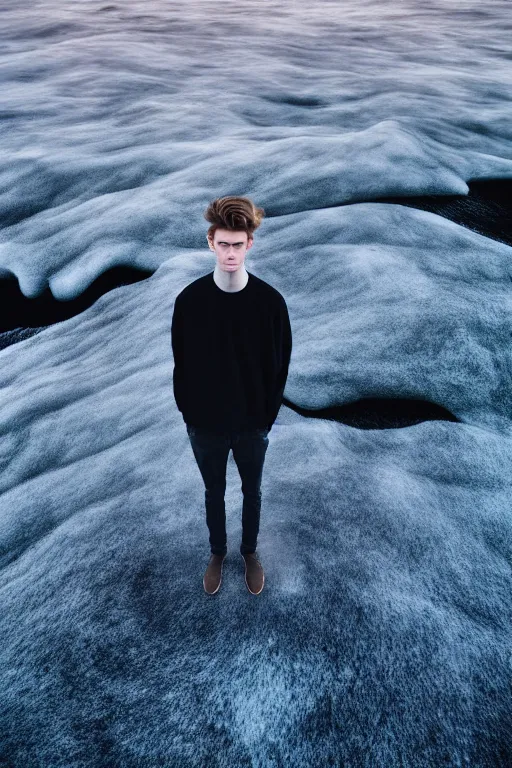 Image similar to high quality pastel coloured film mid angle selfie photograph of a beautiful young 2 0 year old male, soft features, black hair, standing in an icelandic black rock environment. atmospheric. three point light. photographic. art directed. ( pastel colours ). volumetric light. stark. waves glitch. 8 k. filmic.