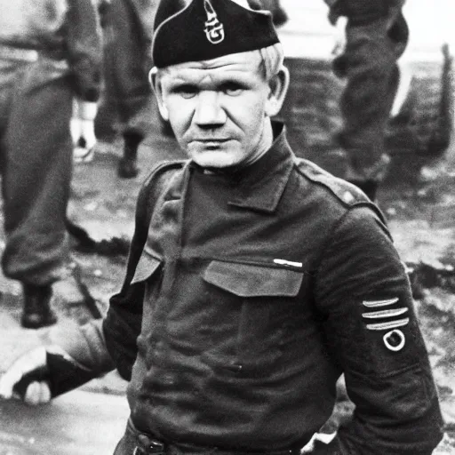 Image similar to Gordon Ramsay as a soldier in WW2, grainy monochrome photo