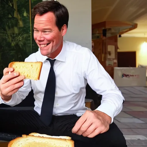 Image similar to mark rutte eating a cheese sandwich