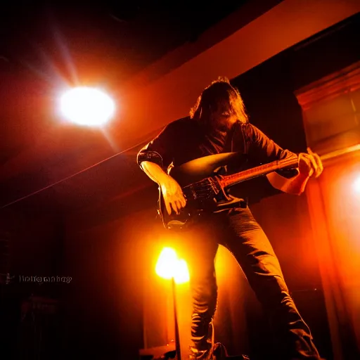 Image similar to a metal concert, lead guitarist playing a guitar solo, dramatic lighting