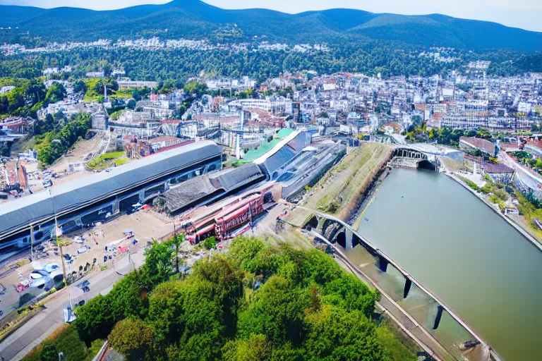 Image similar to bird's eye view photography of a small city. town hall, central farm, monorail station, beach and shipping dock. hills, woods and lake to the north.