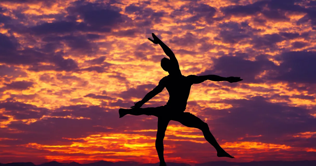 Prompt: wide range photo silhouette of a man doing yoga, at a beautiful sunset, highly detailed, colorful,