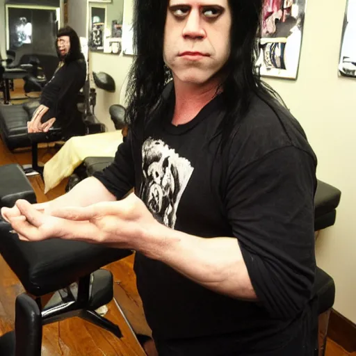 Image similar to glenn danzig with permed hair, at the salon getting a pedicure,