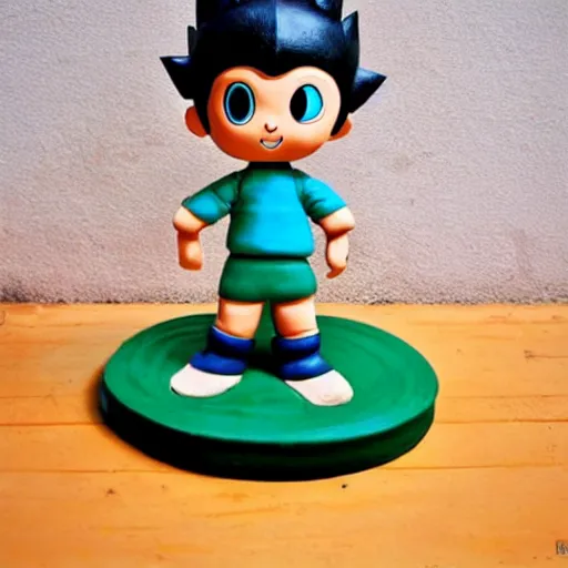 Prompt: simple astro boy made out of clay on wooden table