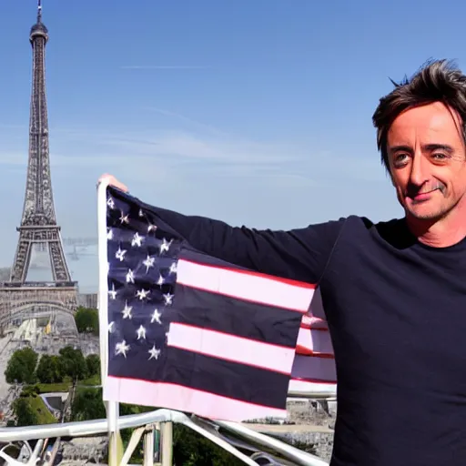 Image similar to Richard Hammond holding up the flag of america on top of the eiffel tower