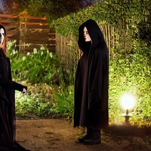 Image similar to a goth brunette woman in a black hooded cloak, standing beside a butch blonde tomboy woman engineer, in a garden at night, soft and romantic