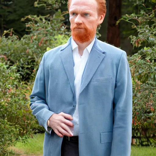 Image similar to full color photograph of an angelic ginger man in his 40s, greenish blue eyes, small nose, clean shaven, no wrinkles, tall, wearing a white shirt and elegant gray dress jacket, looking into the distance
