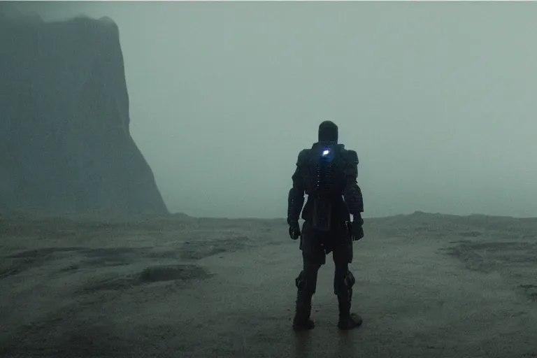 Image similar to still from bladerunner 2049 (2017) man wearing black tactical gear armor. mountain in background ((obscured by fog)) volumetric raining. green hill. Cyberpunk soldier holding rifle intimidating, reflective visor, emissive details. dark low exposure overcast skies. Cybernetic arm robotic arm metal reflective.