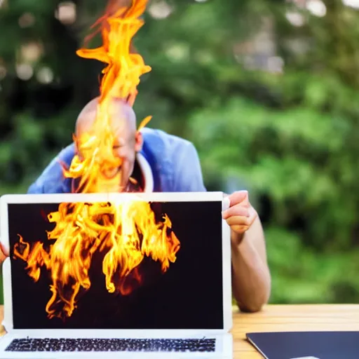 Image similar to person laughing burning a laptop, stock image