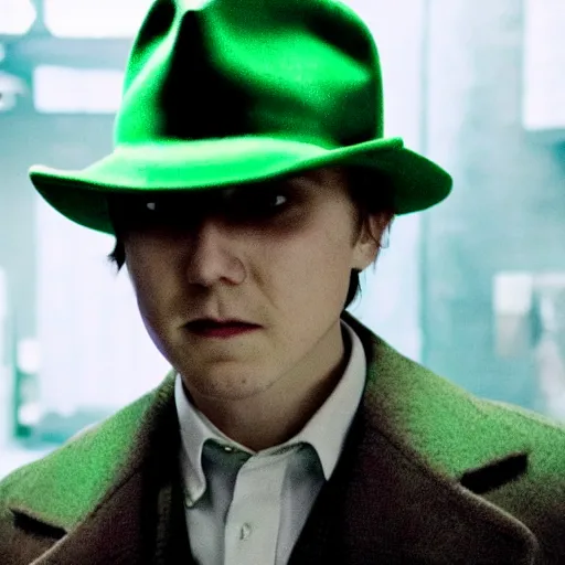Image similar to film still of Paul Dano as Riddler in a green suit and tie and green fedora in The Batman, 4k, dark lighting, film noir, grainy, dark tone