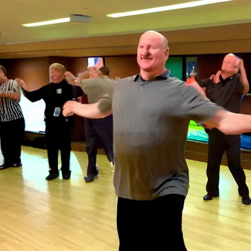 Image similar to Steve Balmer shows off his new dance moves at the club.