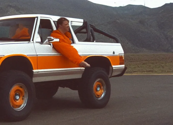Prompt: a human orange juice jar driving a 1 9 9 4 white ford bronco news footage