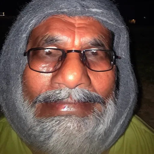 Prompt: my indian dad taking a selfie in the dark and squinting his eyes because the camera flash is too bright