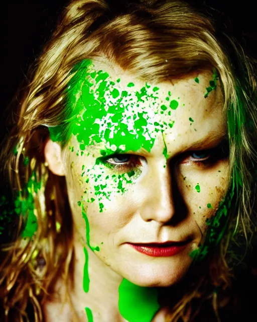 Image similar to photorealistic portrait headshot photos of kirsten dunst with bright green paint splattered across her face. photoshoot in the style of annie leibovitz, photorealistic, bokeh