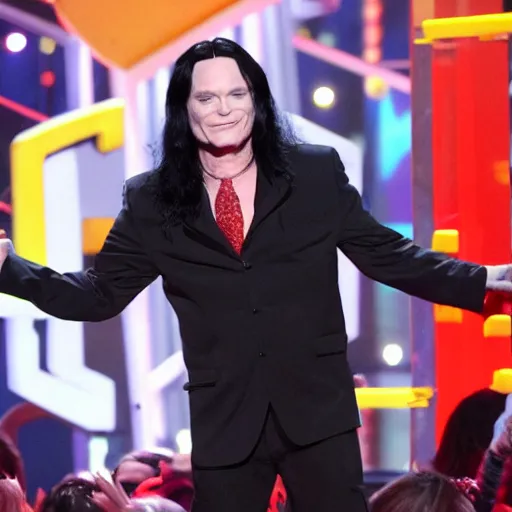 Prompt: Tommy Wiseau gets slimed at the Kid's choice awards