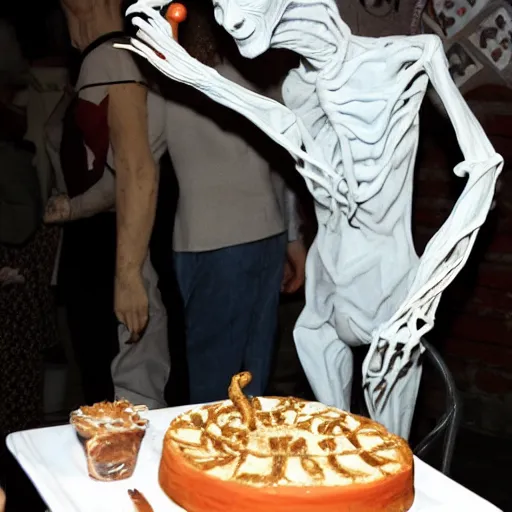 Image similar to the pale man from pan's labyrinth at a birthday party