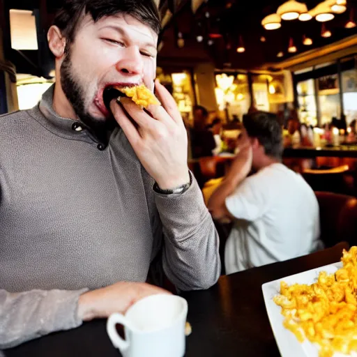 Prompt: a man standing in a busy restaurant while mac n' cheese projectile vomits from his open mouth. The cheese is everywhere. Photograph.