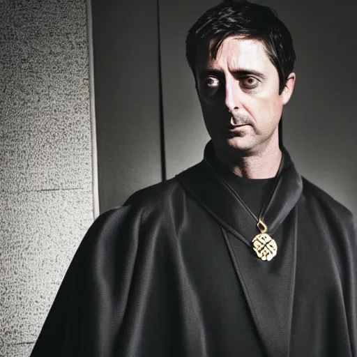 Image similar to mathew goode wearing black robe and golden necklace cinematic photoshoot high quality highly affordable photo realistic 8 k hd