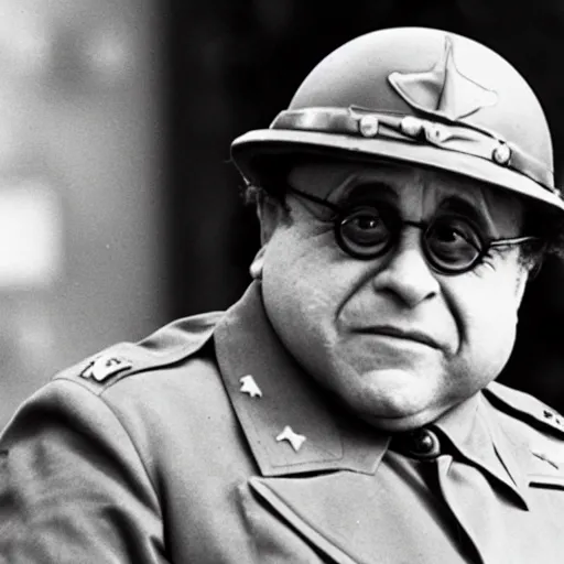 Image similar to Danny DeVito as a WW2 era American general watching a mushroom cloud explode