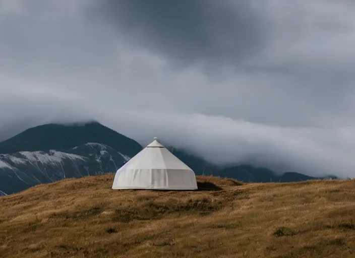 Prompt: a lone yurt on a hill overlooking cloudy mountains in the morning