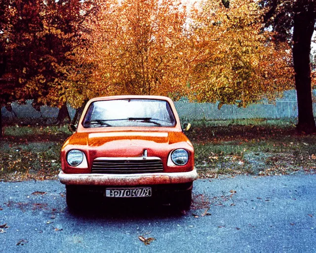 Image similar to a lomographic photo of old lada 2 1 0 7 standing in typical soviet yard in small town, autumn, cinestill, bokeh