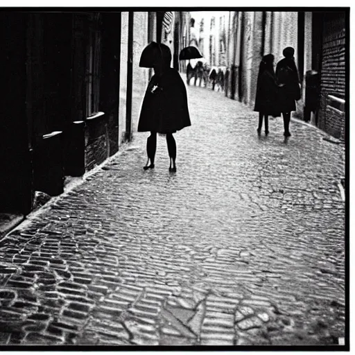 Prompt: fine art photograph of a woman seen from behind she is waiting for the rain to stop, cobblestone street, by henri cartier - bresson