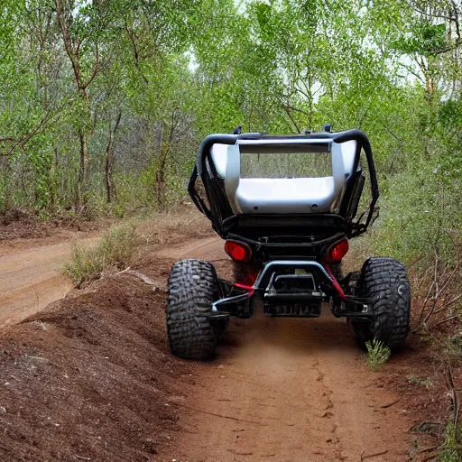 Image similar to an off road buggy drives towards the viewer along a forest dirt track. the vegetation is sparse scrub. the driver is male and smiling. the buggy has an open frame build with mounted search lights. the sky is cloudy and dust is being thrown up by the buggy's wheels