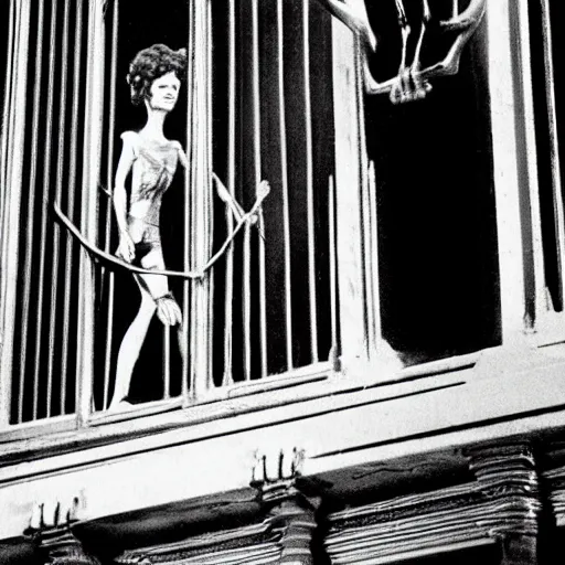 Image similar to detailed still of beautiful Ripley-Sigourney Weaver- wearing a white singlet and cat Jonesy moving apartment New York City 1983, gothic building entrance way Art Deco H.R. Giger, cinematic feel, high octane