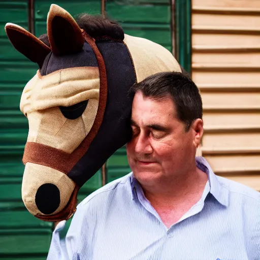 Image similar to man wearing horse head mask on shoulder of man