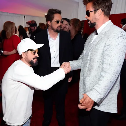 Image similar to ghostface killah dapping up robert downey jr. photo by bill cunningham