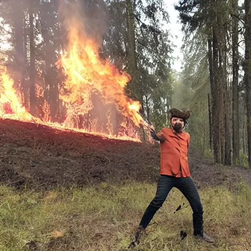 Image similar to a photo of jovanotti burn a forest with flamethrower